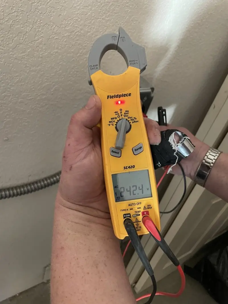 Voltage testing with clamp meter during Electrical Installation Services in South Valley
